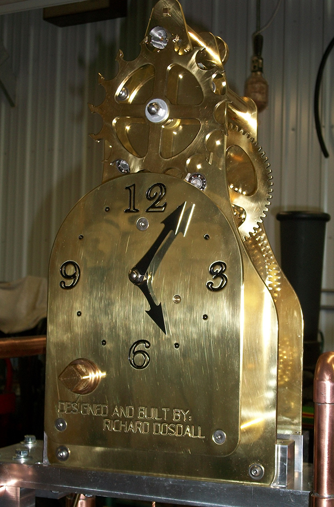 A brass clock designed and built by Rich.