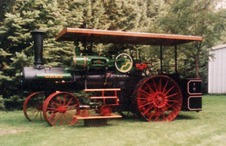 The restored 1911 Case steam engine with Rich's scale model in front. 