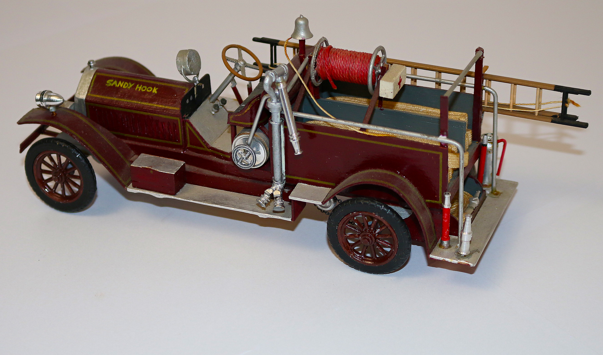 A side view of the scale 1916 American LaFrance chemical car.