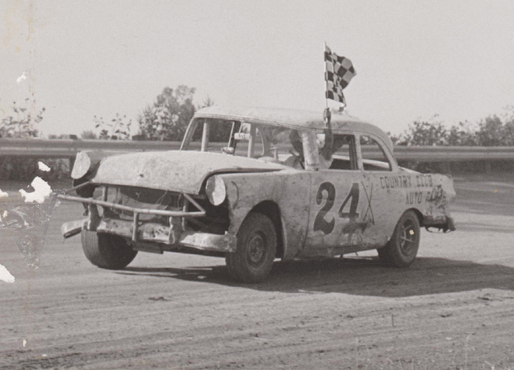 Ernie takes a victory lap in his Ford stock car.