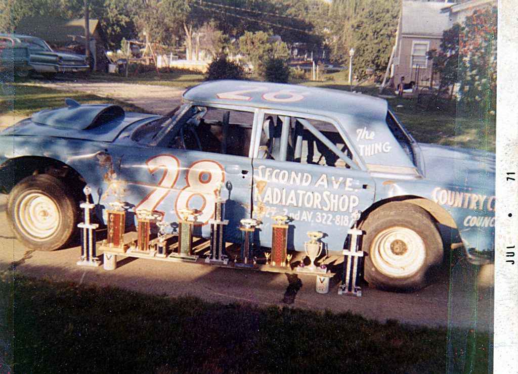 A later stock car of Ernie's with a season's worth of trophies.