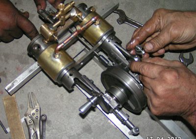 Iqbal at work on the quadricycle engine.
