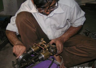 Iqbal assembling the engine.
