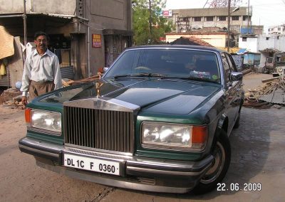 Iqbal standing with the Rolls Royce.