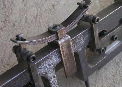 Close-up of leaf springs on trailing truck.