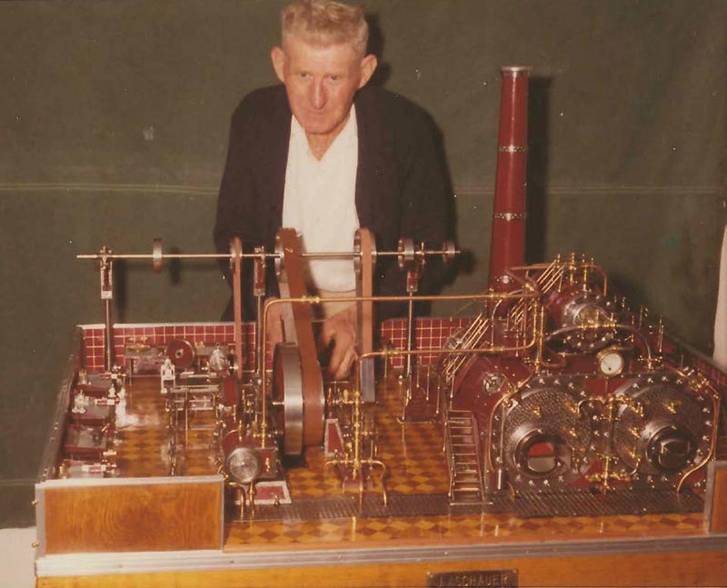 John posing with his steam powered machine shop model.