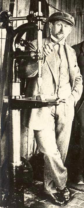 John Aschauer posing with a machine.