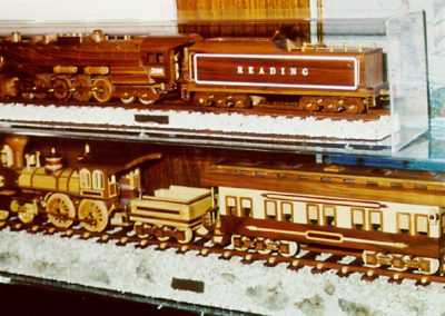 Reading 4-8-4 and old fashioned 4-4-0 engine in their cases.