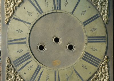 A fourth corroded dial.