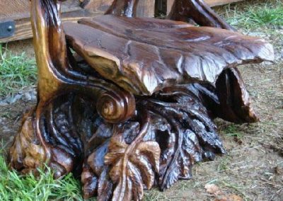 A carved chair of leaves.