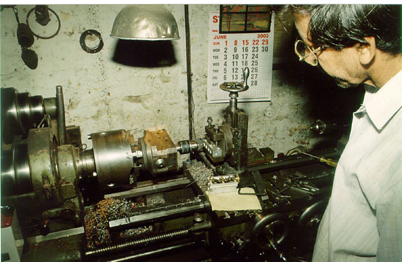 Iqbal using a vertical mill table.