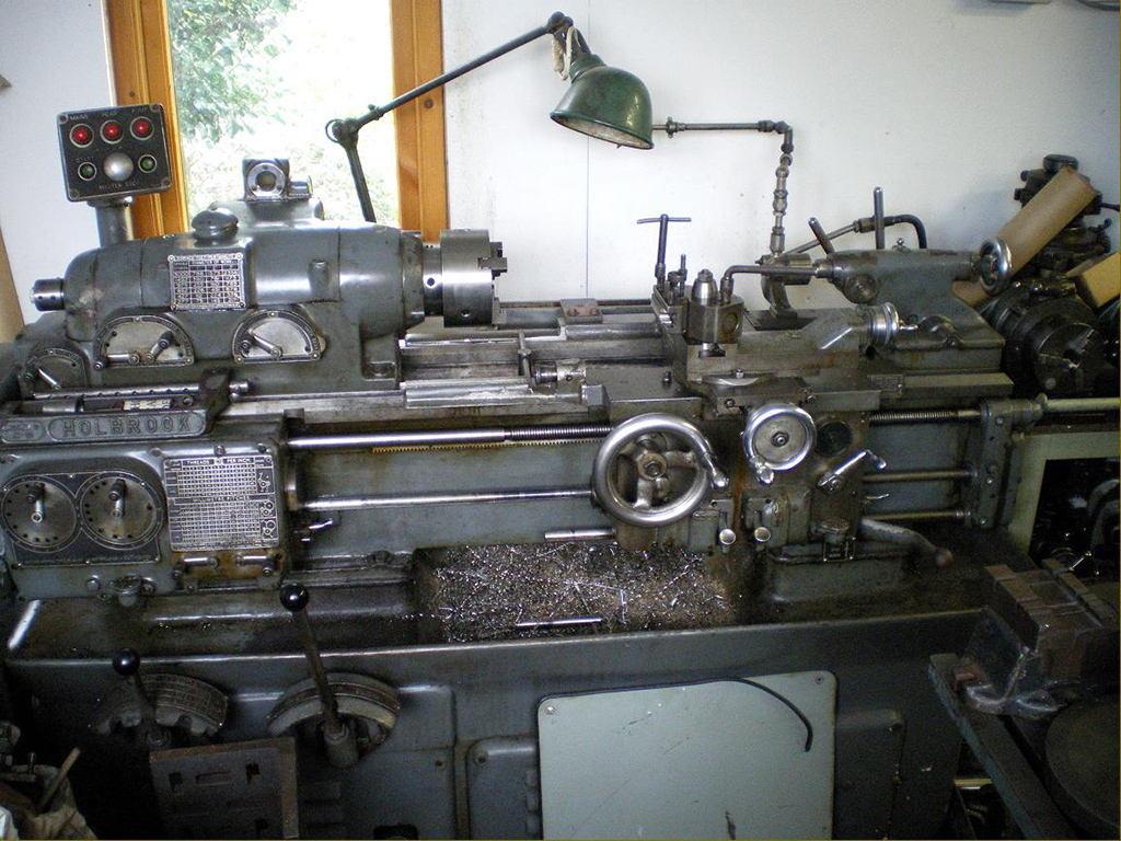 Shown here is an older full-size Holbrook Model C lathe. 