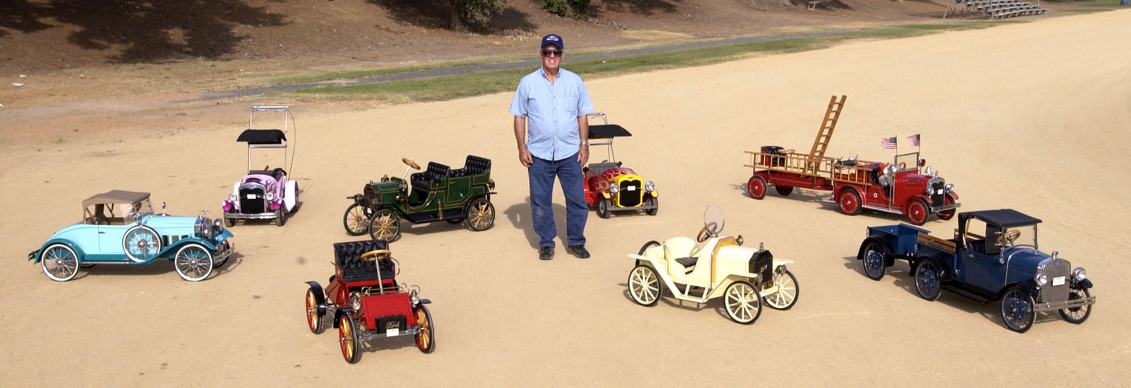 Bill Brown with some of his pedal cars.