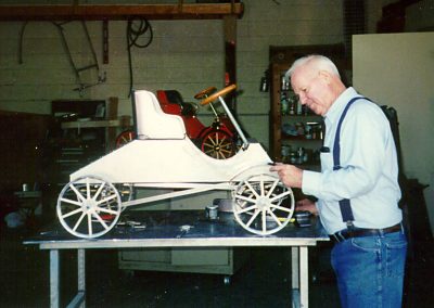 Bill working on a Ford Model A pedal car.