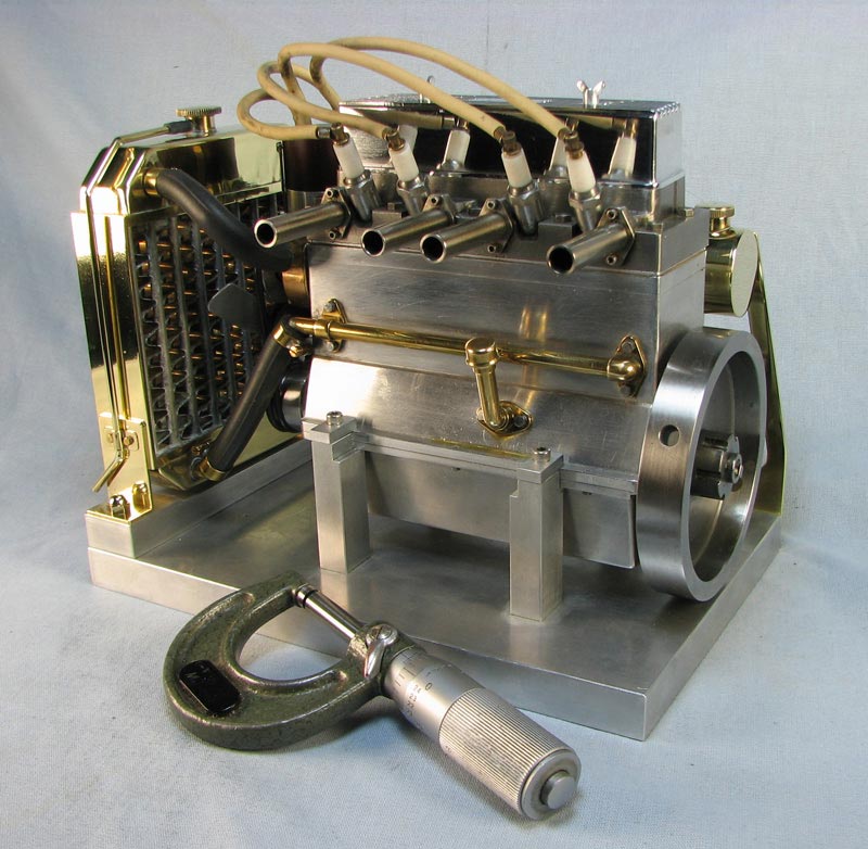 A 4-cylinder OHV valve engine designed and built by George.