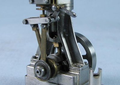 A small vertical steam engine.