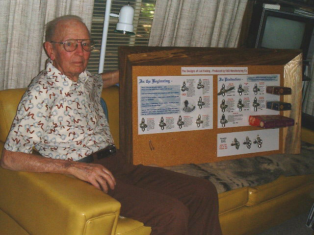 A photo of Lud Kading with a K&B display.