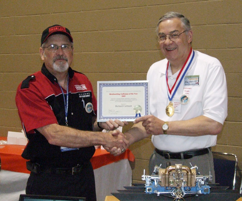Craig Libuse (left) giving Richard his award for Craftsman of the Year.