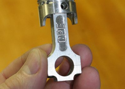 A piston and connecting rod.
