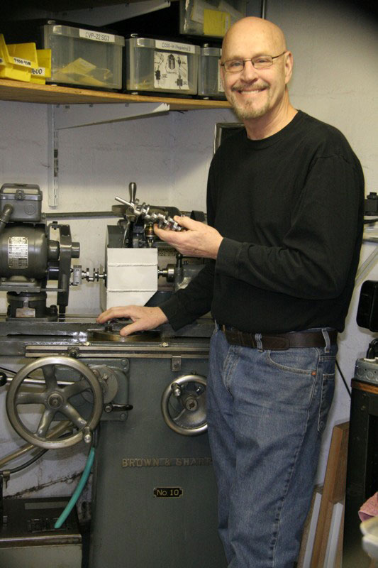 Gary in front of the Brown & Sharp tool cutter and grinder. 