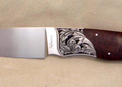 Another knife with foliate design.