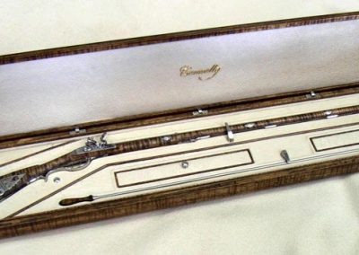 The rifle in its case.