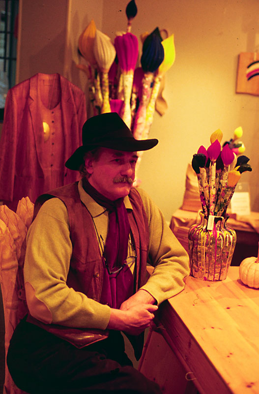 De Marchi in his shop, with carved paint brushes behind him. 