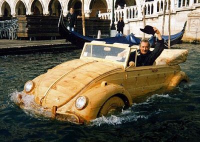 Mr. De Marchi in his floating wooden VW Bug.