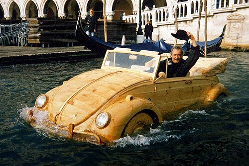 Mr. De Marchi in his floating wooden VW Bug. 