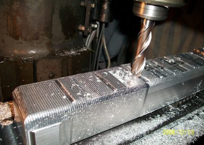 Machining the outside of the valve cover.