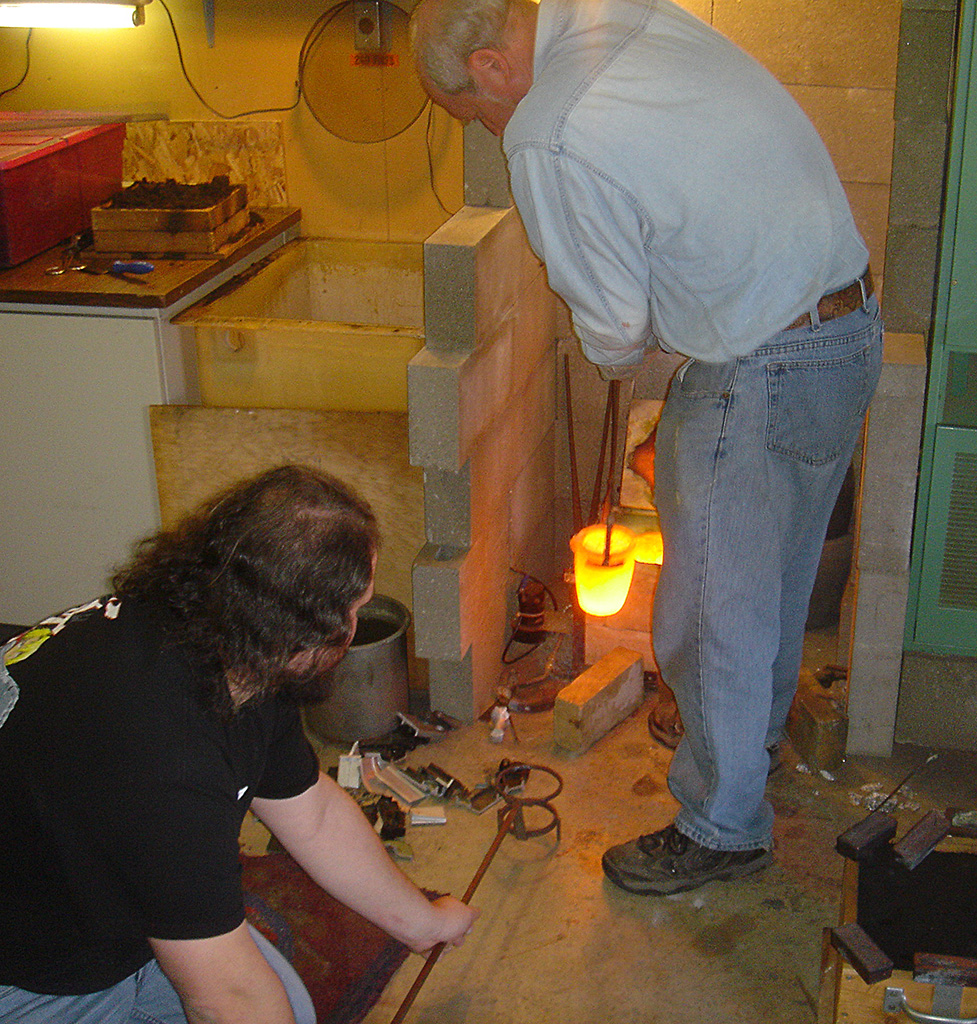 Chuck and his son Jim making castings in the foundry.