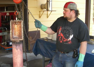 Jim Balmer dipping the boiler in acid.