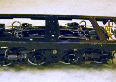 The rear tender frame with assembled tender trucks.