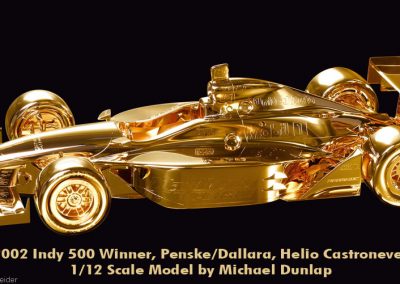 A completed gold model IndyCar.