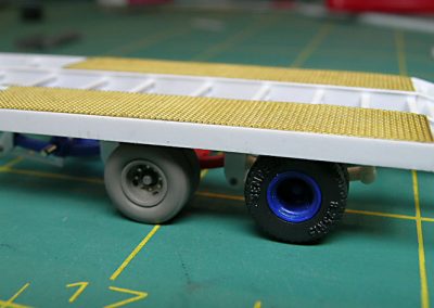 A portion of a scale model flat bed trailer.