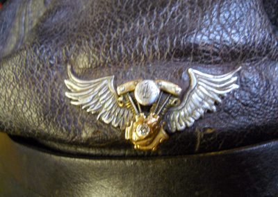 A winged Harley engine pin.