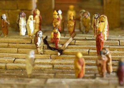 A group of clay figures on the steps.