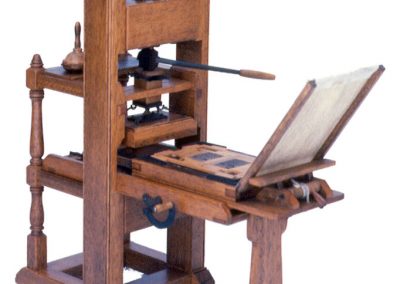 A scale model printing press built by Bill.
