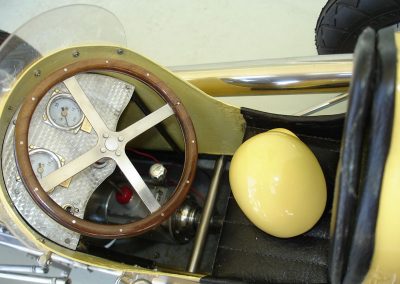 A scale helmet rests on the driver's seat.