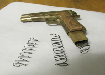 A scale Colt with magazine springs.