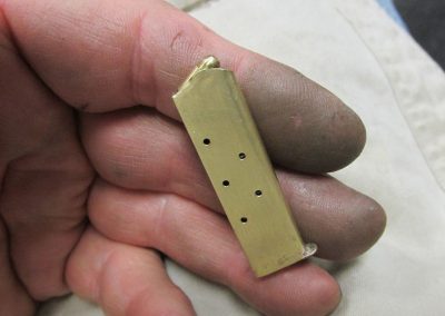 The finished magazine, loaded with dummy rounds.
