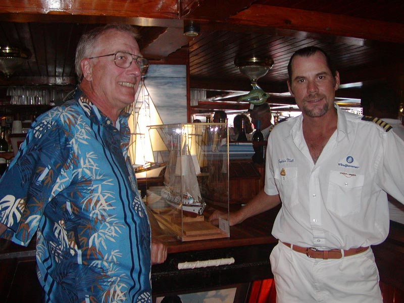 James presents his model of the cruise ship, Mandalay, to the ship's captain.