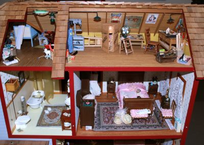 A broad look at the upstairs rooms of the dollhouse.