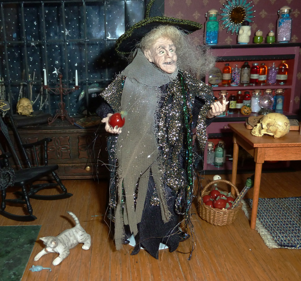 A porcelain witch doll is just one of many figures that decorate these tiny homes. 
