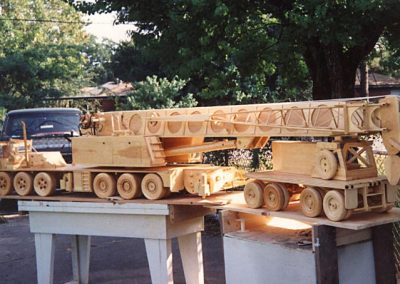 A wooden scale model crane truck.
