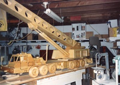 A crane truck sits in Perry's wood shop.