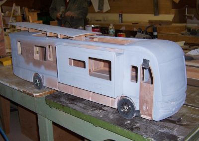 A side view of the unfinished motorhome model.