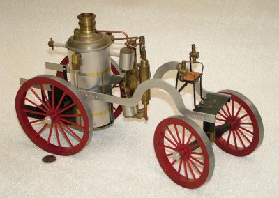 A scale model of a horse-drawn fire pump.