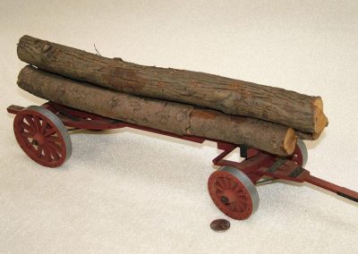 A scale model wagon with realistic wooden load.