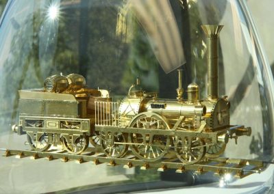 The miniature Adler now enclosed in glass.